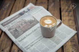 It may be a vip. A Newspaper And A Cup Of Coffee On A Wooden Table Stock Photo Picture And Royalty Free Image Image 37199023