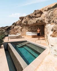 A Suite Built Into The Cliff Cap Rocat Is A Former Fortress Built For The Surveillance Of The Bay Of Palma In Mallorca Now Guests Urlaub Reisen Mallorca