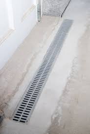 French drains collect excess surface water and channel it away. Davenport Trench Drain Drainage Solutions Midamerica Basement Systems