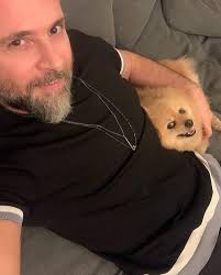 This is my husband, Joe. Joe said NO DOGS! Especially not a yappy little  chihuahua. Now Joe and Louie are the best of friends 💙🐶💙