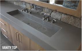 Corian® glacier white solid surface vanity top, intergrated sink and back/side splash. Custom Concrete Sinks