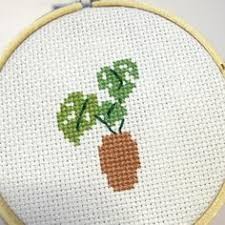 Navy lettering with cranberry, dark pink, yellow and orange flowers. 110 Cross Stitch Housewarming Ideas Cross Stitch Stitch Cross Stitch Patterns