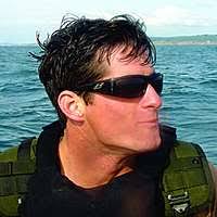 In an undated file photo provided by the U.S. Navy, Master-At-Arms 2nd  Class (SEAL) Michael A. Monsoor poses for a photo with members of his SEAL  team during Operation Iraqi Freedom. -