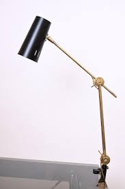 These special lamps replace the traditional base with a clipping or clamping mechanism that can attach to desk and table lips, shelves, poles and scaffolding. Rare Stilnovo Clamp Desk Lamp Circa 1950 For Sale At 1stdibs
