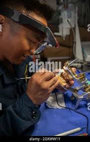 U.S. Navy Medical Corpsman 1st Class Daniel Doe, pharmacy outpatient  instructor, oversees medication orders during a class at the Medical  Education and Training Center (METC), Joint Base San Antonio-Fort Sam  Houston, Texas,