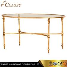 Brown/gold medium round wood coffee table with lift top. China Luxury Modern Oval Coffee Table In Golden Stainless Steel Bamboo Legs And Tempered Glass Top China Glass Table Round Coffee Table