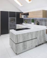 Matte grey kitchen with metal countertops and some wooden cabinets added. Colour Focus Grey Kitchens Stoneham Kitchens