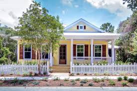 For the outside of their home, jessica and scott paired light grey exterior paint with black trim, and a bright yellow front door. 12 Charming Yellow Houses Town Country Living