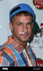 Jersey Shore" star Mike "The Situation" Sorrentino steps out of an SUV with  his reported girlfriend, who was then attacked by a "romantic rival" as the  couple exited the vehicle. A scuffle