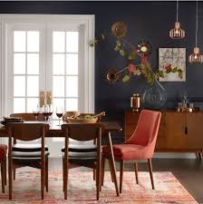 A Mid Century Modern Dining Room With Trendy Dark And Moody Walls Red End Chairs Dani Modern Dining Room Set Mid Century Modern Dining Room Dark Dining Room