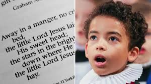 What are the lyrics to 'Away in a Manger', and why does the carol have two  melodies?