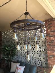 24 Wagon Wheel Chandelier With 3 Tiers Of Vintage Bulb Lights Comes With 9 Vintage Bulbs Diy Chandelier Wagon Wheel Decor Wheel Decor