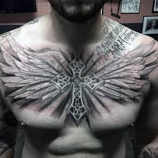 The angel wing tattoo on the chest of this guy is applied with elegance and a unique touch of art. What Does Cross With Wings Tattoo Mean Represent Symbolism