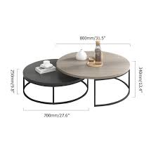 The triangle shaped tops have a smooth grey reclaimed wood look laminate finish, contrasting with tapered, black metal tripod shaped legs. Modern Round Nesting 2 Piece Extendable Gray Black Living Room Accent Coffee Table Modern Living Room Table Living Room Accent Tables Round Coffee Table Living Room