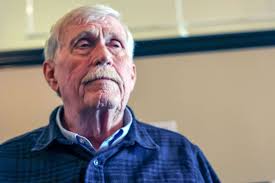 Kaleva man making signs to prevent impaired driving in Michigan