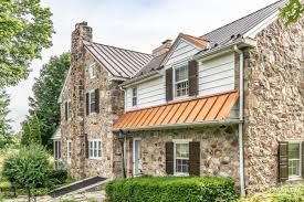 We live up a big hill and my house is a raised ranch and therefore higher in the air. Perme House With Textured Bronze And Copper Penny Roof A B Martin Roofing Supply