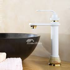 There's something about the luxe veiny stone that just makes a small utilitarian space feel so elegant. Modern Bathroom Faucets Single Handle White Painting Marble Brass