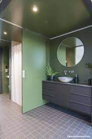 You can choose a matching floor design with small pieces of square tiles and incorporate light coloured cabinets and sinks to retain the softness of the shade. A Partition Wall In Resene Olive Green Helps Divide Up A Multi Use Small Bathroom Space Green Bathroom Bathroom Colors Bathroom Big