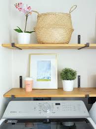 If it's in a closet, build a shelf an inch or two above the washer and place the dryer on that. Disguising Ugly Stuff In A Laundry Room Young House Love