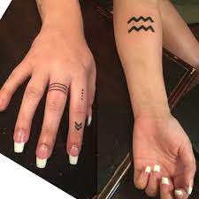Aquarius Arm Tattoo Amp Simple Elegant Symbol Finger Tattoos By Brandon Aquarius Tattoo Designs Aquarius Tattoo Finger Tattoos