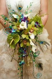 We would like to show you a description here but the site won't allow us. Orchids Anthurium Calla Lilies Peacock Feathers And Swirls Of Wire Created By Plant And F Teal Wedding Bouquet Fake Flowers Decor Calla Lily Bouquet Wedding