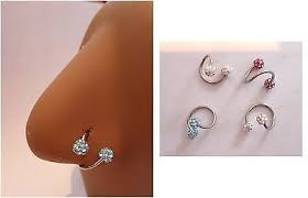 Second, gently fit the ring into you pierced nose by gliding one open end of the hoop into the hole. Pin On Nose Jewelry