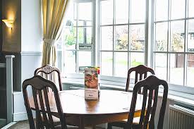 A bay window is actually just a regular window but the unusual feature is the way it communicates with the rest of the house and its walls. Bay Window Table Picture Of Cheese Rollers Inn Cheltenham Tripadvisor