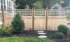Small garden black painted fence. How To Paint A Wooden Fence With A Sprayer Wagner Diy