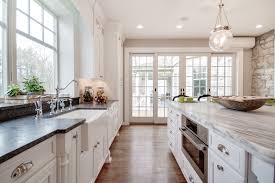 5 bedrooms, bloomfield schools, and a great yard for plenty of fun and entertainment! This Bright White Kitchen Features A Mont Blanc Honed Quartzite Island Countertop With A Silver Pearl Kitchen Countertops Countertops White Kitchen Traditional