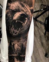 This wearer is from alaska and got the grizzly bear to symbolize the fact that he is a native of that place. 30 Bear Tattoo Designs For The Rough Individual Tats N Rings Bear Tattoo Designs Bear Tattoo Animal Tattoos
