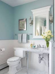 The copper pendant light holder and the black frame for the glass shower door add dashes of color. Captivating Bathroom Vanity Ideas For Small Bathrooms Design Gorgeous Feminine Small Bathroom Blue Bathroom Decor Small Bathroom Vanities Light Blue Bathroom