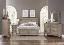 A king storage bedroom set with a minimal panel headboard evokes a modern feel. Bethel King Storage Set