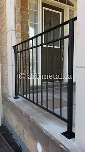 This house features a gray exterior and has a warm interior and exterior lighting. Outdoor Porch Railing Designs From Wood Wrought Iron And Steel