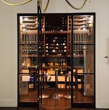 Learn more order now introducing the slimline ls the new slimline ls has evolved into a single system with a plethora of enhanced features that provide powerful performance, quiet operation, and prolonged system longevity to protect your investment in fine wine for years to come. Insulated Glass Door And Reliable Wine Cellar Cooling System For A Dallas Home Transitional Wine Cellar Los Angeles By Us Cellar Systems Houzz