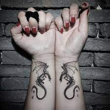 35 Unique Dragon Tattoo Designs And Meaning Cool Mythology Dragon Tattoo Wrist Dragon Tattoos For Men Tattoos For Guys