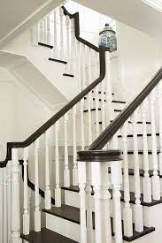 Wood handrails are a classic design and can complement just about any home style. White And Brown Staircase Design Ideas