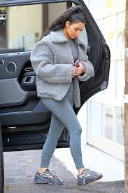 The Moment Kim Kardashian Stepped Onto The Street In These Sneakers They Went Viral Kardashian Outfit Kim Kardashian Outfits Kim Kardashian Yeezy