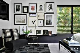 Racing chair comfortable chair gaming chair chair red chair green chair ergonomic chair black and white chair accent chairs for sale. There S No Shortage Of Fun In This Tropical Modern Delray Oasis Black And White Bedroom Corner With Gallery Wall Black Chair And Black Rug Luxe Interiors Design