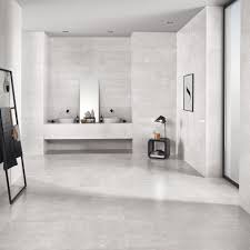 This bathroom features copper and marble fixtures next to light gray hexagon tiles. Shine Light Grey Wall Tile Tileflair