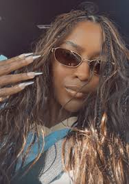 Ciara Miller's Brown Slim Oval Sunglasses