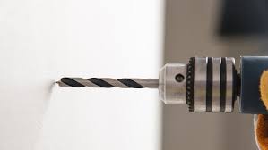 I'm trying to drill into the outer wall of this room at the height of the attic, but when i drill, instead of sawdust, it's some gray crumbly dust. Before Drilling Holes In Your Walls Read This Or Risk A Diy Disaster