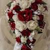 Top your white wedding cake with red flowers that match your floral displays or bouquet. 1