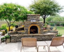 Wood fireplaces have a distinctive feeling. Outside Fireplace Outdoor Fireplace Design Backyard Fireplace Outdoor Stone Fireplaces Outdoor Fireplace