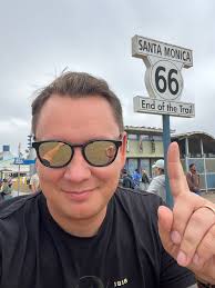 What are the pros and cons of taking I-90 versus I-80 for a cross-country  road trip from NYC?