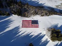 Giant American flag takes a trip down Sundance ski slope