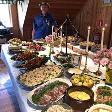 An outdoor buffet of seafood is a common feature of the swedish midsummer celebration. Facebook