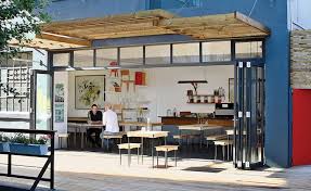 Two Cool Surfers Design Some Serious Furniture Coffee Shop Design Coffee Shop Shop Design