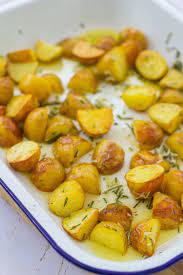 Roasted New Potatoes With Garlic And Rosemary Recipe Potatoes Potates Recipes New Potato