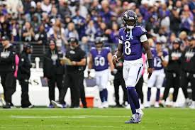 Lamar Jackson on the sideline during the Ravens Titans game