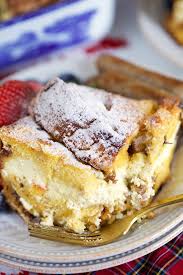 Cheesecake Stuffed Panettone French Toast Casserole On A White Plate Panettone French Toast French Toast Casserole French Toast Casserole Recipes